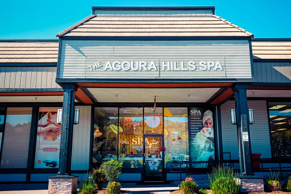 The Agoura Hills Spa storefront on Kanan Road — white channel letters over the entrance under a blue sky